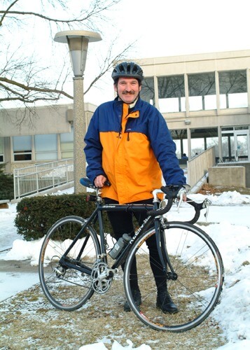 Setting a good example: Carpenter commutes on his bike to work – even in the winter – from suburban Batavia to DeKalb.