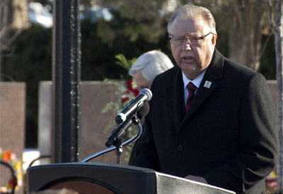 NIU President John G. Peters speaks Monday, Feb. 14, at the Presentation of the Memorial Wreaths.