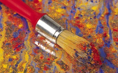 Photo of a paint brush on canvas