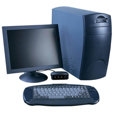 Photo of a computer keyboard, hard drive, montior and mouse