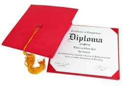 Photo of a diploma and graduation cap