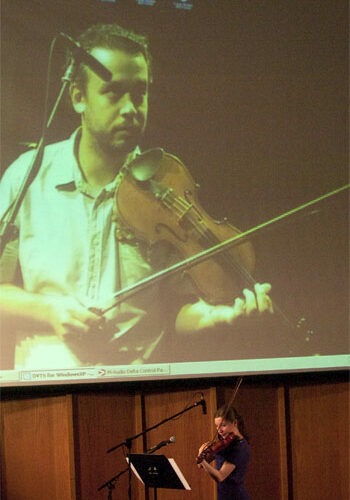 Manel Porta (on screen) teaches a lesson to recent NIU School of Music alumna Katelyn Kozinski via Internet 2.