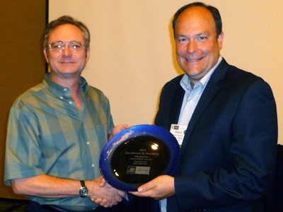 Robert Peterson, right, is congratulated by Mark Johlke, vice president of the Sales Special Interest Group of AMA.