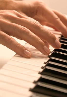 Photo of fingers on piano keys