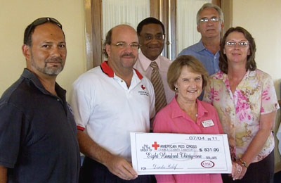 Members of NIU’s operating staff recently raised $840 for the American Red Cross’s disaster relief fund at the recent StaffFest event. Presenting the check are from left, StaffFest co-chair Carlos Raices, Red Cross representatives Brad Osborn and Sharon Rhoades, NIU Executive Vice President of Business and Finance and Chief of Operations Eddie Williams, NIU OSC President Andy Small and StaffFest co-chair Danell Nixon.