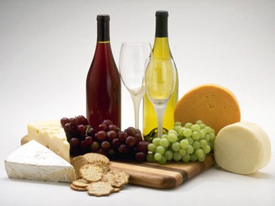 Photo of wine, cheese and fruit