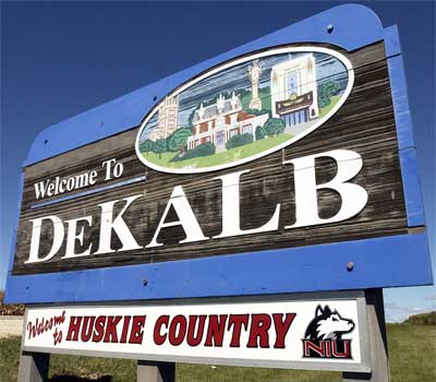Photo of a "Welcome to DeKalb: Huskie Country" road sign