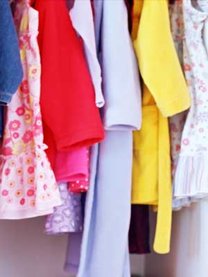 Photo of women's clothing hanging in a closet