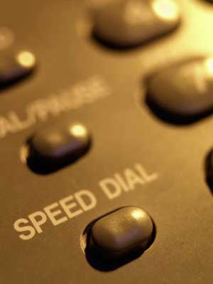 Photo of the "Speed Dial" button on a telephone