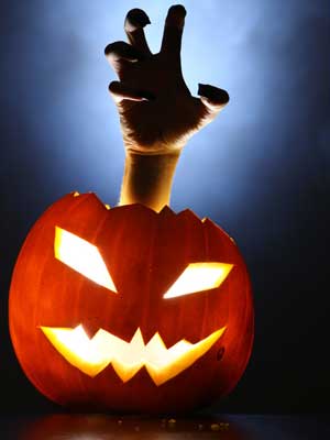 Photo of jack-o-lantern with hand reaching out