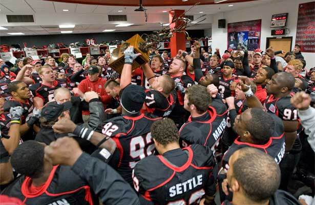 The NIU Huskies celebrate with the Bronze Stalk after the Nov. 15 victory.