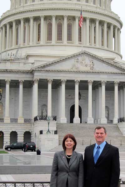 Lisa Freeman and Timothy Hagen stand outside the U.S. Capitol.