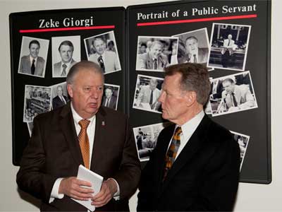 NIU President John Peters and Mike Madigan, speaker of the Illinois House of Representatives, speak Wednesday during the 10th anniversary celebration of NIU's Zeke Giorgi Legal Clinic.