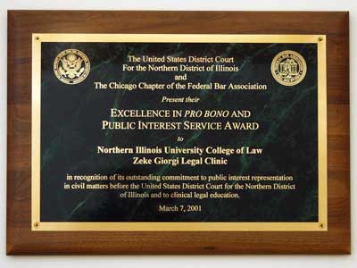 Photo of a plaque awarded to NIU's Zeke Giorgi Legal Clinic for excellence in pro bono and public interest services.