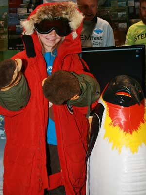Kids tried on Ross Powell’s Arctic gear. Powell, an NIU Board of Trustees Professor of geology, is one of the creators of the DOER submarine, which will explore the West Antarctic Ice Sheet in 2013.