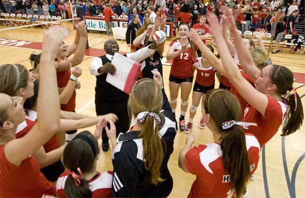 Coach Ray Gooden and the NIU volleyball team celebrate!
