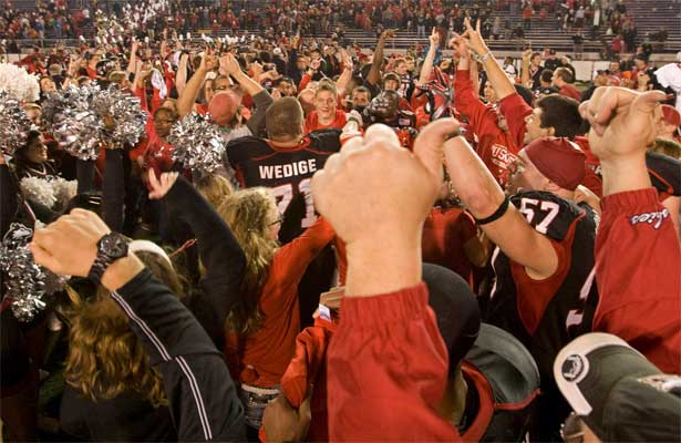 NIU Huskie football players and fans celebrate the GoDaddy.com Bowl win in Mobile, Ala.