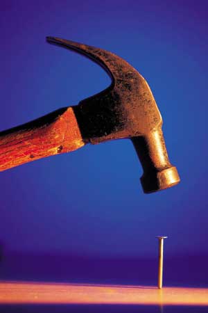Photo of a hammer and a nail