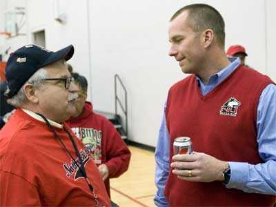 Coach Doeren chats with a Huskies fan at the 2011 HASF kickoff event.