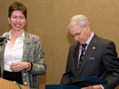 Illinois Lt. Gov. Sheila Simon gives the Illinois Rural Champion Lifetime Achievement Award to NIU’s Norman Walzer during a March 7 conference in Peoria.