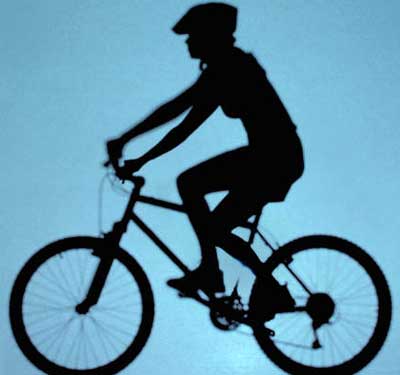 Silhouetted image of a bicycle rider