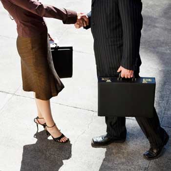 Photo of a businesswoman and businessman shaking hands