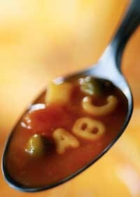 Photo of a spoonful of alphabet soup with A, B and C noodles