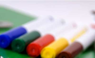 A photo of blue, green, red, yellow and brown markers
