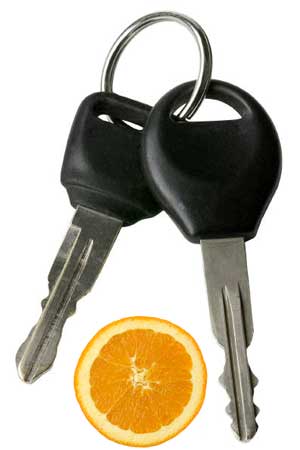 Image of car keys and an orange wedge