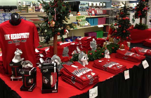 Photo of a Christmastime display of NIU Huskie gear at the University Bookstore.