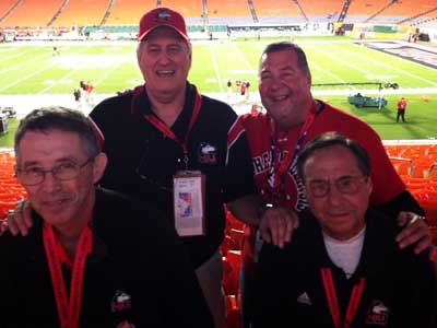 After 47 years of Huskie loyalty, NIU fans Mike Feinstein and Frank Olds (front) and Don Sitarz and Joe Holoubek (back) are cheering their team in a BCS bowl.