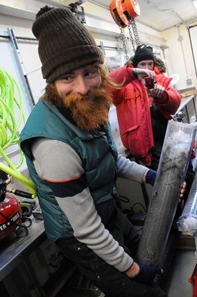 NIU Ph.D. student Timothy Hodson with a core from the subglacial lake.
