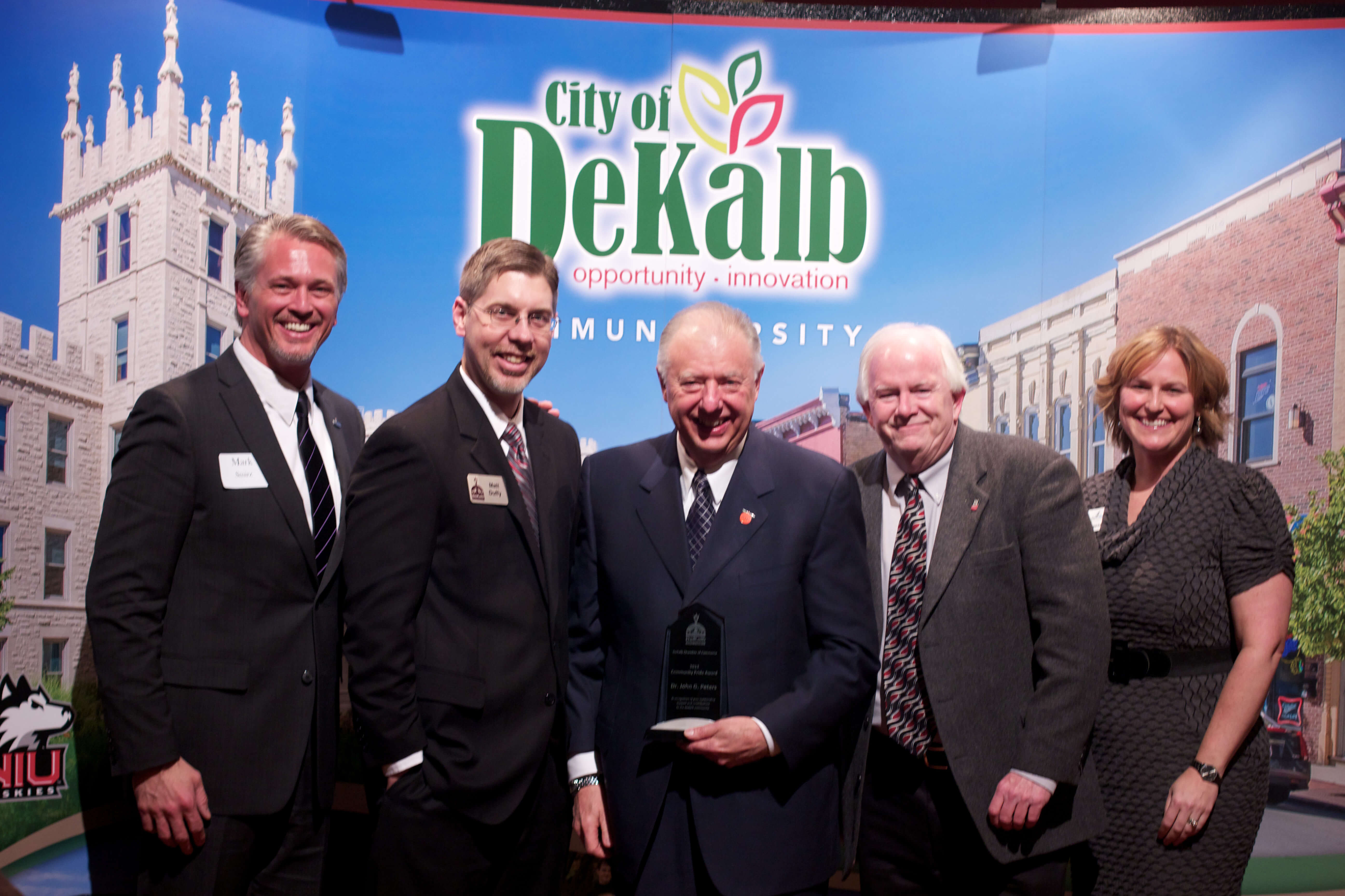 President John G. Peters (center) receives the Community Pride Award, flanked by (left to right) Mark Smirz, Matt Duffy, Bill Finucane and Wendy West-Krauch.
