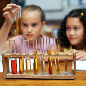 Photo of two girls working with test tubes