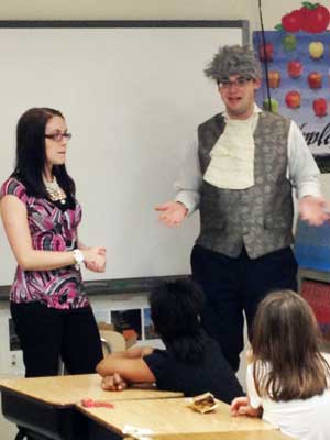 NIU students talk Monday to Tyler Elementary School fourth-graders about Money Smart Week.