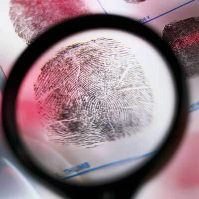 Photo of a fingerprint under a magnifying glass
