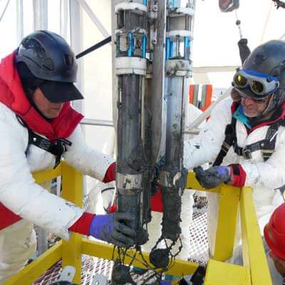 Ross Powell (left) and fellow NIU geologist Reed Scherer recovered sediment from a subglacial Antarctic lake bed.