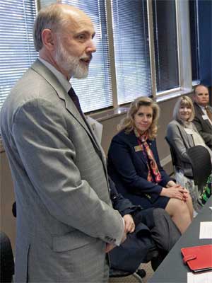 Baker speaks with Rockford-area leaders during his visit there May 23.
