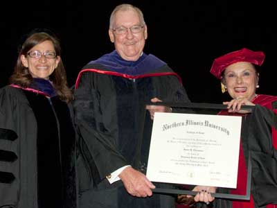 NIU Law Dean Jennifer Rosato (left) and Cherilyn Murer (’78), chair of the NIU Board of Trustees, present Gov. James Thompson with an honorary Doctorate of Law degree during NIU Law’s commencement ceremony. Thompson also was featured as the commencement speaker.