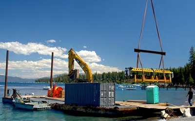 The robotic submarine is loaded onto the barge on Lake Tahoe.