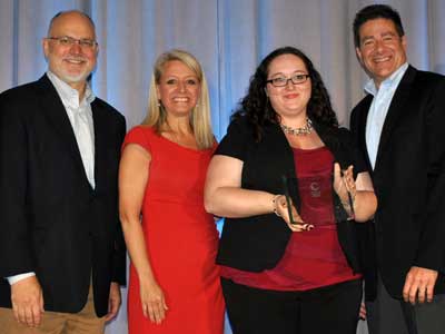 Stephanie Richter, instructional technologies coordinator at NIU, receives an award from Blackboard executives Ray Henderson and Stacey Fontenot (left) and Maurice Heiblum, president and general manager of Blackboard Collaborate.