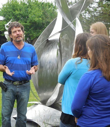 McKearn Fellows meet with alumnus and renowned artist Bruce Niemi while on a visit to his sculpture gallery and garden.