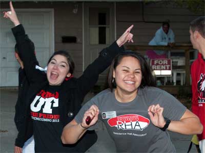 Students celebrate NIU during the 2012 Homecoming parade.