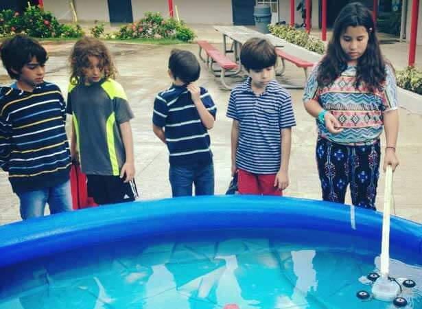 Children in Puerto Rico explored Waterbotics, a relatively new STEM field that creates underwater robotics, thanks to NIU mechanical engineering graduate student Pettee Guererro.