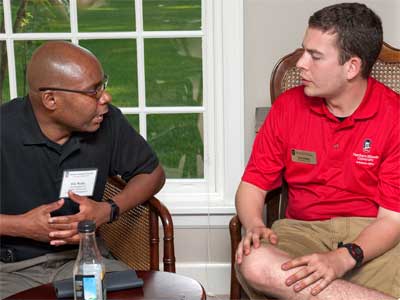 Weldy chats with Orientation Leader Eric Glasby.