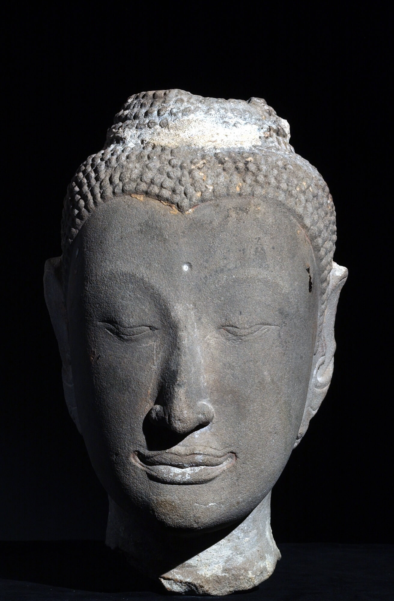 This stone head from Thailand, dating from between the 16th and 17th centuries, will be on display for the first time in the “Tai Cultures” exhibit.