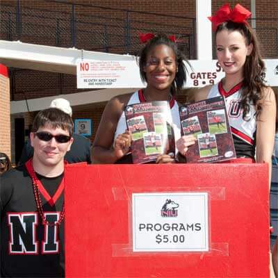 Huskie cheerleaders selling programs