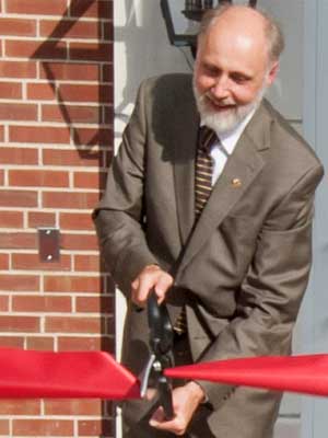NIU President Doug Baker cuts the ribbon at Gilbert Hall.