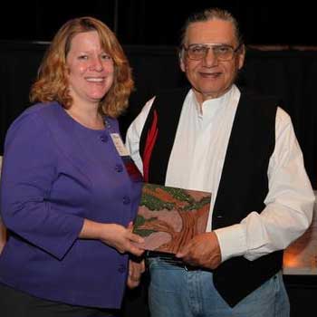 Carlos Velazquez receives the Rosa Parks and Grace Lee Boggs Outstanding Service Award in 2011.