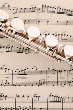 Photo of a flute laying on sheet music
